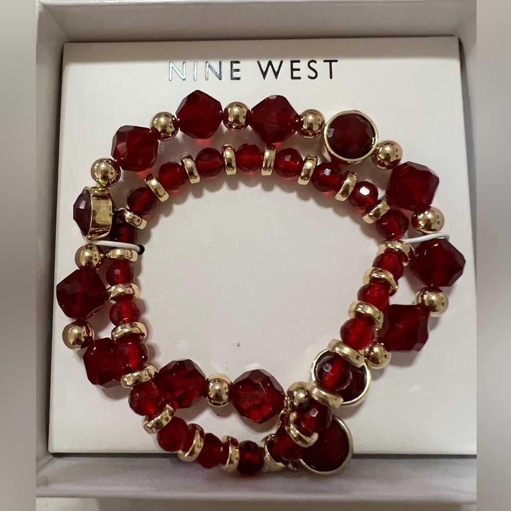 Nine West brand beautiful gold tone with red stones bracelet